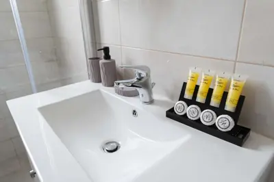 a bathroom sink with a toothbrush holder on it at Modern spacious apartment located in Piraeus (B8) in Piraeus