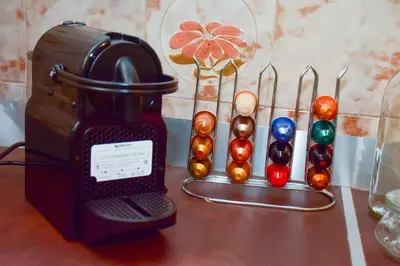 a table with a blender and a group of pins at Filoxenia Apartment Athens in Athens