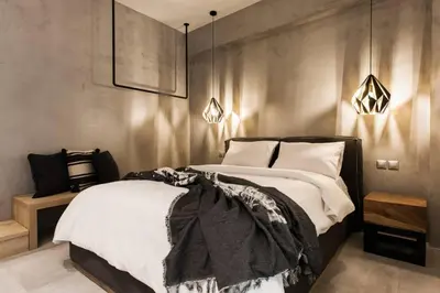 a bedroom with a large bed with white pillows at Chic Apartment - Strolling to the Athenian streets in Athens