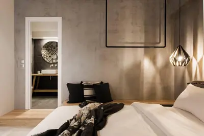 a bedroom with a bed and a hallway with a sink at Chic Apartment - Strolling to the Athenian streets in Athens