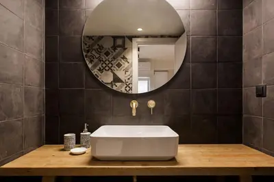 a bathroom with a white tub and a mirror at Chic Apartment - Strolling to the Athenian streets in Athens