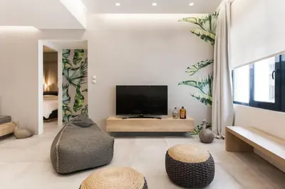 a living room with a flat screen tv on a wall at Chic Apartment - Strolling to the Athenian streets in Athens