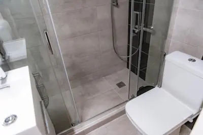 a bathroom with a shower with a toilet and a sink at Pnyka Apartment 3 in Athens