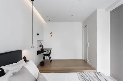 a bedroom with white walls and a bed and a desk at Marvelous 2BR Apartments with balcony by UPSTREET in Athens