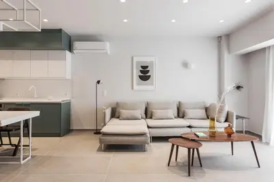 a living room with a couch and a table at Marvelous 2BR Apartments with balcony by UPSTREET in Athens
