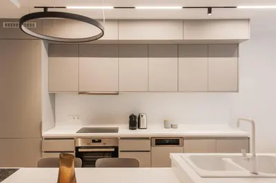 a kitchen with white cabinets and a sink at Marvelous 2BR Apartments with balcony by UPSTREET in Athens