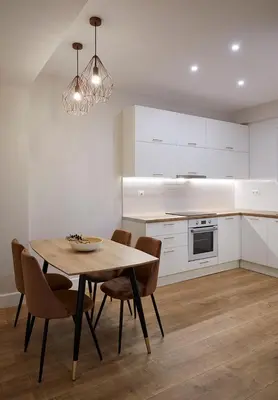 a kitchen with a table and chairs in a kitchen at Central & Comfy apartment 2mins walking from metro in Athens