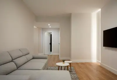 a living room with a couch and a tv at Central & Comfy apartment 2mins walking from metro in Athens