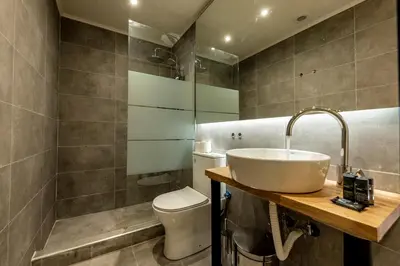 a bathroom with a sink and a toilet at Phaedrus Living: City Center Executive Flat Stadiou in Athens