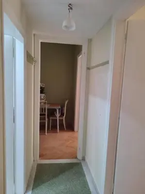 an empty hallway with a room with a table and a door at lovely penthouse at the center! in Athens