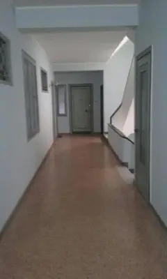 an empty hallway of an empty building with a staircase at lovely penthouse at the center! in Athens
