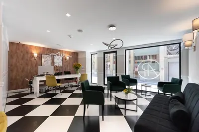 a living room with a black and white checkered floor at Pure Hotel by Athens Prime Hotels in Athens