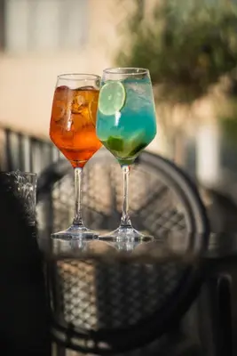two glasses of drinks sitting on a table at Pure Hotel by Athens Prime Hotels in Athens