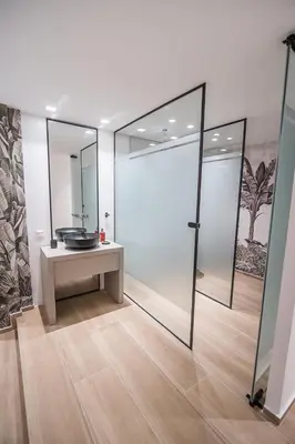 a bathroom with a sink and a mirror at Millennial Apartments Trikoupi in Athens