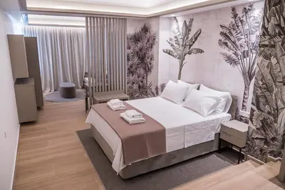 a bedroom with a large bed in a room at Millennial Apartments Trikoupi in Athens