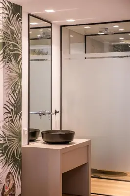 a bathroom with a sink and a mirror at Millennial Apartments Trikoupi in Athens