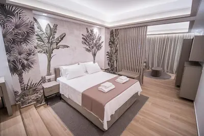 a bedroom with a bed with two towels on it at Millennial Apartments Trikoupi in Athens