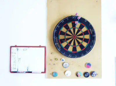a dart board on a wall with balls and a clipboard at PRIVATE BEDROOMS IN SHARED APARTMENT 135 SM ATHENS Center in Athens
