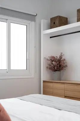 a bedroom with a bed and a window at KASO - Fotomara in Athens
