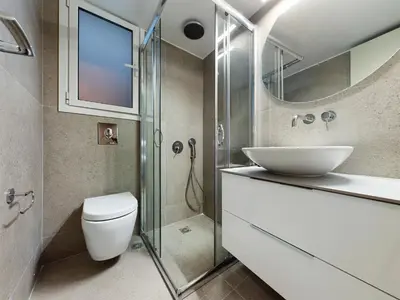 a bathroom with a toilet and a sink and a shower at KASO - Fotomara in Athens