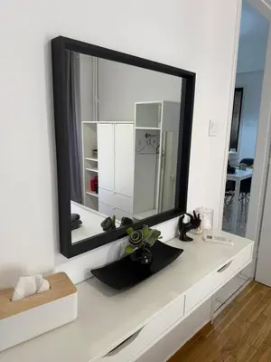 a mirror sitting on a counter in a room at Pagrati apartment Διαμέρισμα Παγκράτι in Athens
