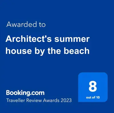 a screenshot of a phone with the text awarded to architects summer house by at Architect's summer house by the beach in Porto Rafti