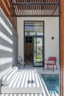 a patio with a bench and a pool at The Newel Psychiko in Athens