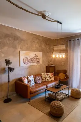 a living room with a couch and a table at MS APARTMENT in Athens