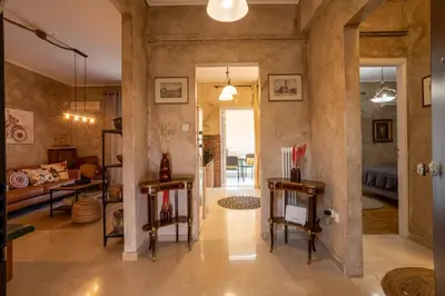 a living room with a couch and a table at MS APARTMENT in Athens
