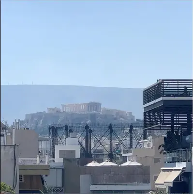 a view of the acropolis from a city with buildings at Fab New Flat in Central Athens w/ Acropolis Views in Athens