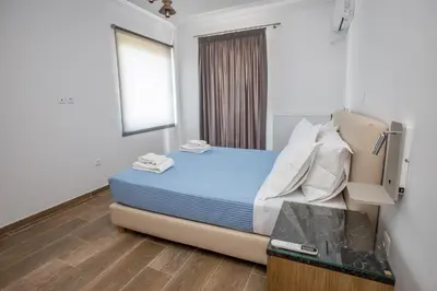 a room with a bed in a room with a window at Raise Kifisias Serviced Apartments in Athens