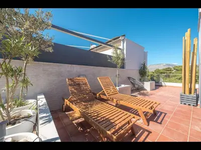 two wooden benches sitting on a patio at Adelos III Bloom Villa 5BR 360m - Sauna - Rooftop in Athens