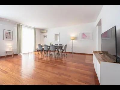 a living room with a dining room table and chairs at Adelos III Bloom Villa 5BR 360m - Sauna - Rooftop in Athens