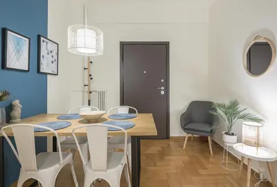 a dining room with a table and chairs at City Suite by Cloudkeys in Athens