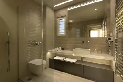 a bathroom with a toilet and a sink and a shower at Über Lux 2 BR New Penthouse with Acropolis View in Athens