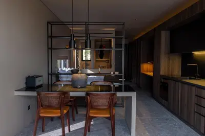 a kitchen and dining room with a table and chairs at Vouliagmeni Apartments 18 in Athens