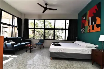 a bedroom with a bed and a couch at Central urban studio A in Athens