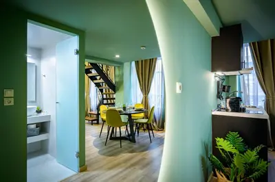 a kitchen and dining room with a table and chairs at Urban Tales in Athens