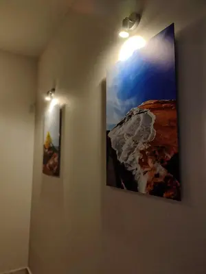 two pictures hanging on a wall in a room at Seaview-Apartments in Palaiá Fókaia