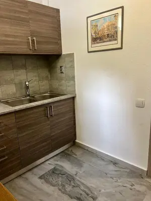 a kitchen with a sink and a counter top at New apartment at Athenian Riviera in Athens