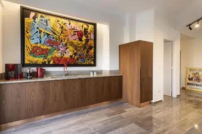 a lobby with a large painting on the wall at A Truly WOW Experience for Every Guest. THE place in Athens