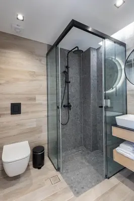 a bathroom with a shower and a toilet at LUX&EASY Athens Downtown Residences in Athens