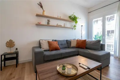 a living room with a couch and a coffee table at ☆Kalimarmaro 3BD Apt For Max Fun & Comfortability☆ in Athens
