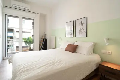 a bedroom with a large white bed and a window at ☆Kalimarmaro 3BD Apt For Max Fun & Comfortability☆ in Athens