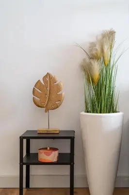 a table with a plant and a white vase at ☆Kalimarmaro 3BD Apt For Max Fun & Comfortability☆ in Athens