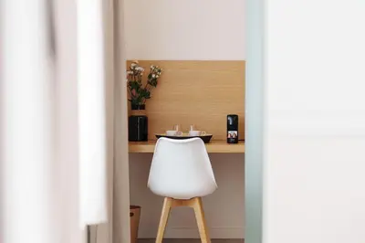 a white chair sitting in front of a table at Agora Athens Suites in Athens