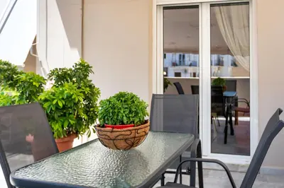 a potted plant sitting on a table on a balcony at The Athenian Penthouse Residence in Athens