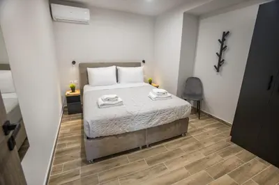 a bedroom with a bed with two towels on it at Raise Averof Serviced Apartments in Athens
