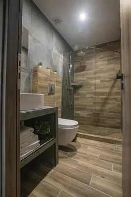 a bathroom with a toilet and a sink and a shower at Raise Averof Serviced Apartments in Athens