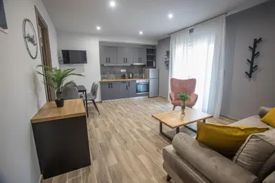 a living room with a couch and a table at Raise Averof Serviced Apartments in Athens